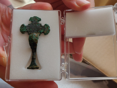 cross shaped brooch in clear box